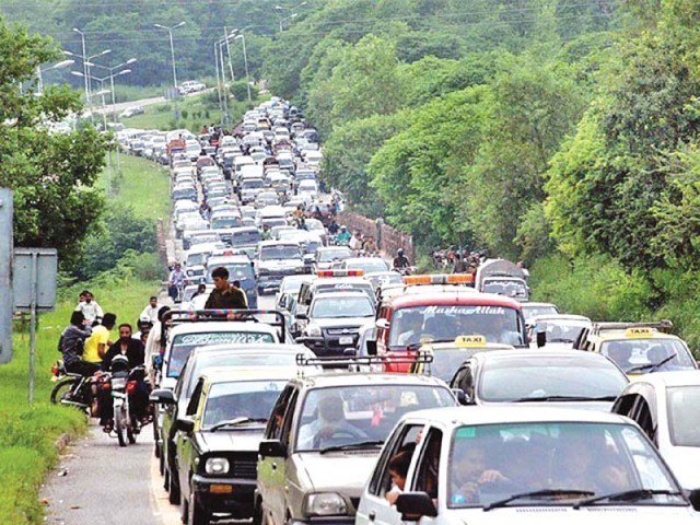 young doctors from three public hospitals on thursday brought traffic on the murree road to a halt photo express