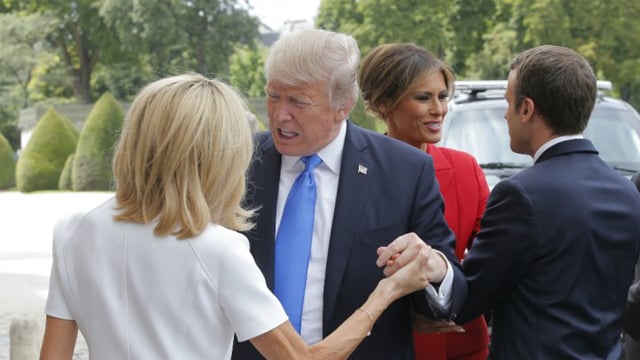 french president emmanuel macron r welcomes us first lady melania trump 2nd r while his wife brigitte macron l welcomes us president donald trump 2nd l in paris on july 13 2017 photo afp