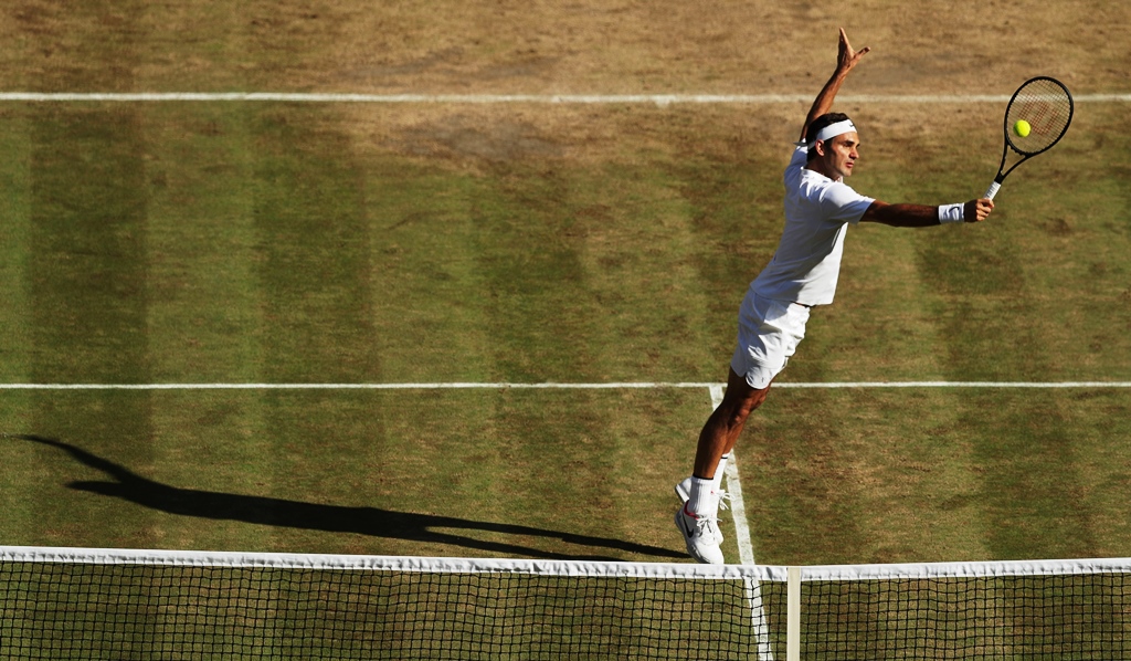 class act federer continues to defy the critics and time as he reached the final without dropping a single set photo afp