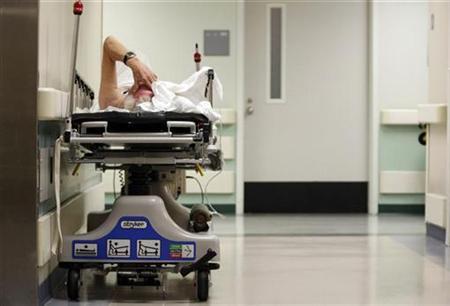 a patient waits in the hallway of a hospital photo reuters