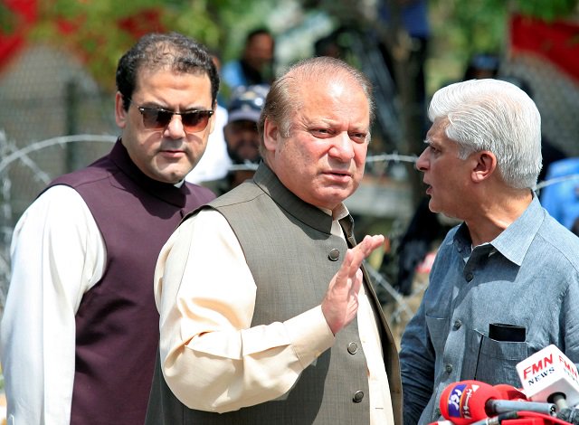 prime minister nawaz sharif waves as his son hussain nawaz looks on photo reuters