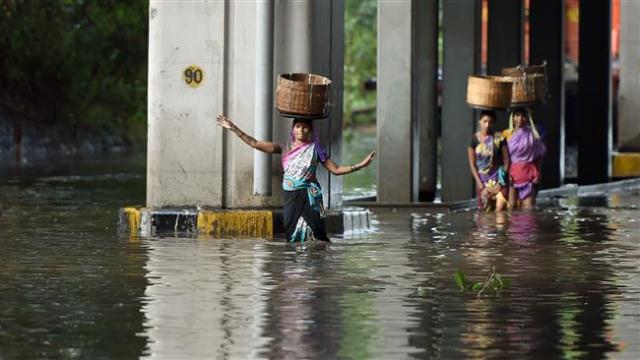 flooding has risen to at least 76 officials said monday with eight people killed in the past day photo afp