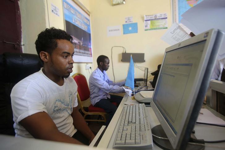 an internet cafe manager uses a computer in an internet cafe in the hodan area of mogadishu photo reuters