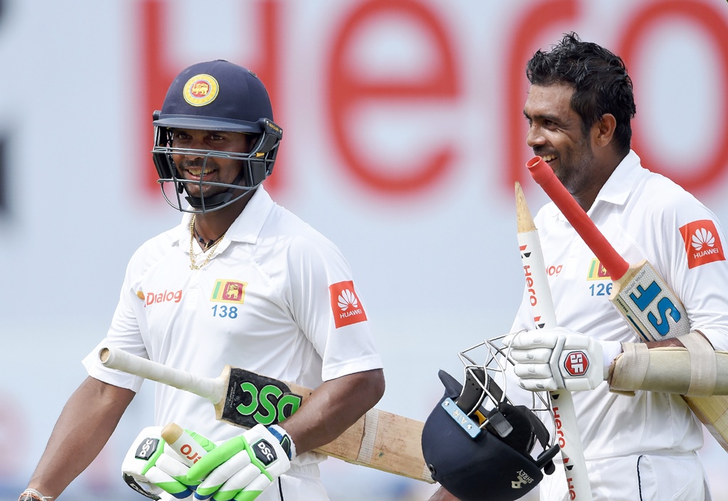 taking them home gunaratne s unbeaten 80 helped sri lanka over the line as conditions worsened for the batsmen photo afp