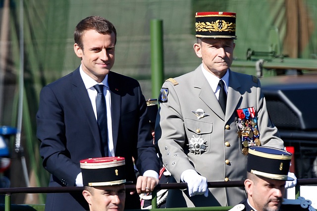 french president emmanuel macron l and chief of the defence staff french army general pierre de villiers r attend the traditional bastille day military parade on the champs elysees in paris france july 14 2017 photo reuters