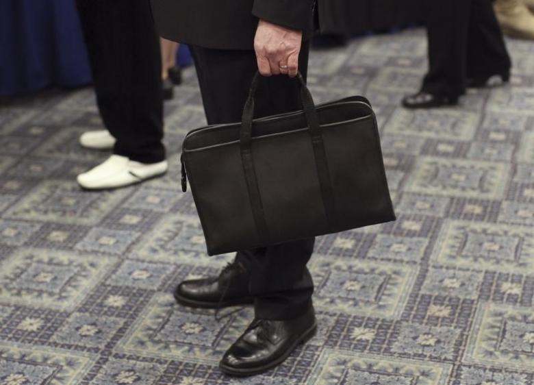 a man holds his briefcase photo reuters