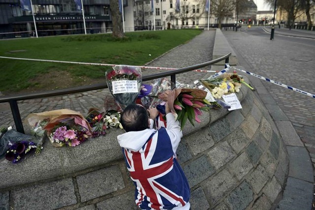 a man wears a union flag sweatshirt near the houses of parliament in westminster the day after an attack in london britain march 23 2017 photo reuters