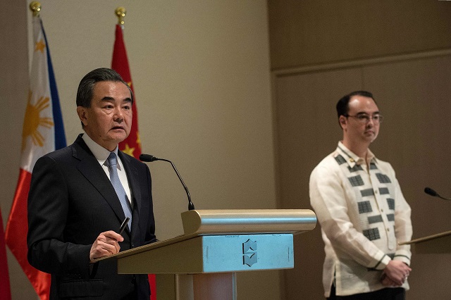 china 039 s foreign minister wang yi l and philippine foreign affairs secretary alan peter cayetano r attend a joint press conference in manila on july 25 2017 china urged southeast asian nations on july 25 to unite and quot say no quot to outside forces seeking to interfere in the south china sea dispute   an apparent swipe at the united states ahead of a regional summit china 039 s foreign minister wang yi made the statement during a two day visit to manila where he hailed the quot strong momentum quot in the improvement of bilateral ties under philippine president rodrigo duterte photo afp