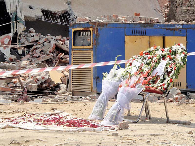 mourners have placed bouquets at the blast site in memory of the martyred photo nni