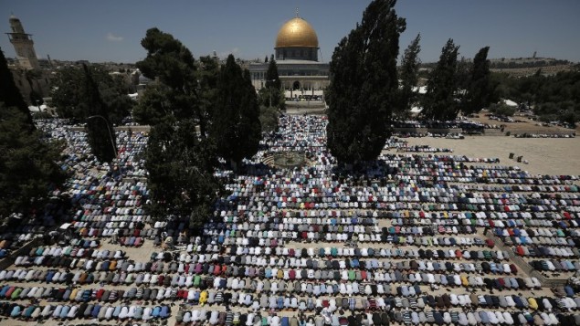 palestinian muslim worshipers pray outside the dome of the rock at the al aqsa compound in jerusalem during the first friday prayer of the holy month of ramadan photo afp