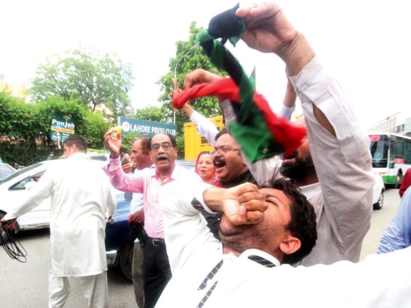 a man celebrates the panamagate verdict outside the lahore press club photo abid nawaz express