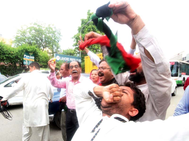 a man celebrates the panamagate verdict outside the lahore press club photo express