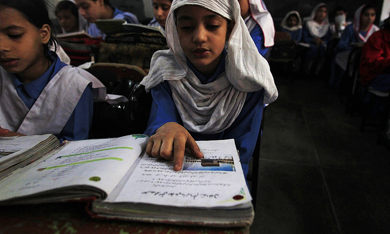a girl reading in a school somewhere in balochistan photo reuters