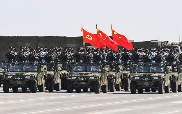 4 chinese soldiers carry the flags of l to r the communist party the state and the people 039 s liberation army during a military parade at the zhurihe training base in china 039 s northern inner mongolia region photo afp