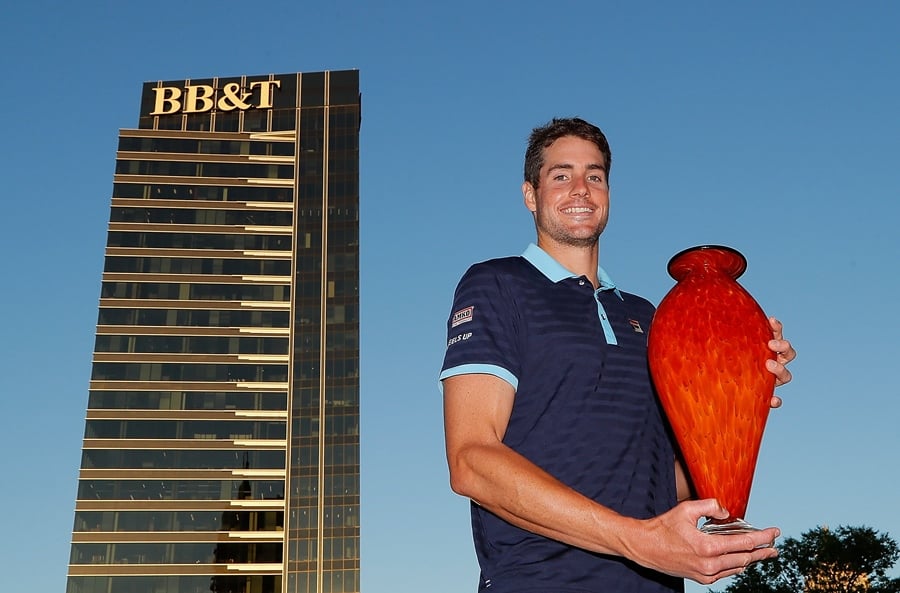 john isner poses with the trophy after winning the bb amp t atlanta open at atlantic station on july 30 2017 in atlanta photo afp