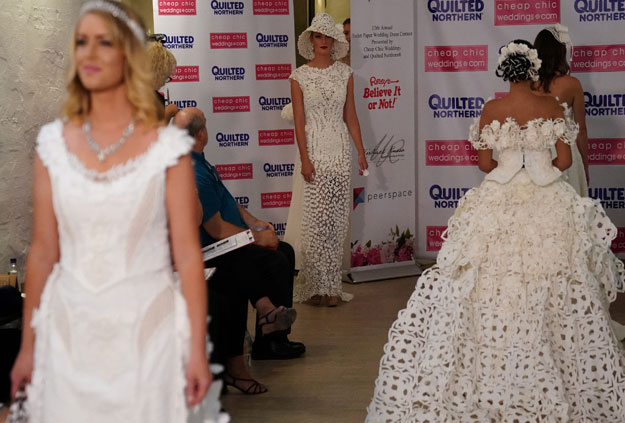 Models present wedding dresses made out of toilet paper during a fashion show in the Manhattan borough of New York City, New York, US July 20, 2017. PHOTO: REUTERS