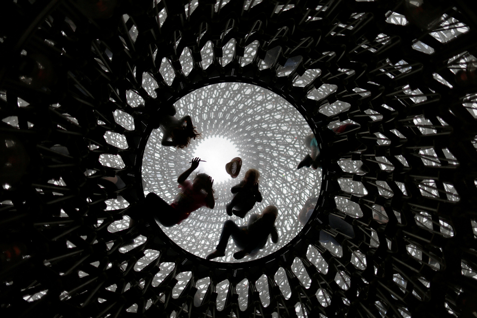 Children play inside the Hive, designed by artist Wolfgang Buttress, at Kew Gardens, in London, Britain. PHOTO: REUTERS