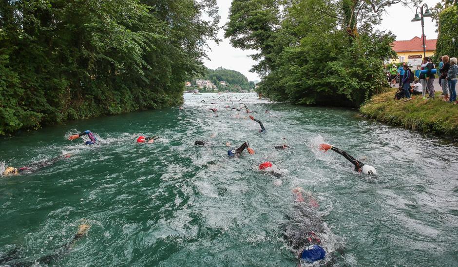 Competitors swim in the Lend channel during the Ironman Austria 2017 in Klagenfurt, Austria. PHOTO: AFP