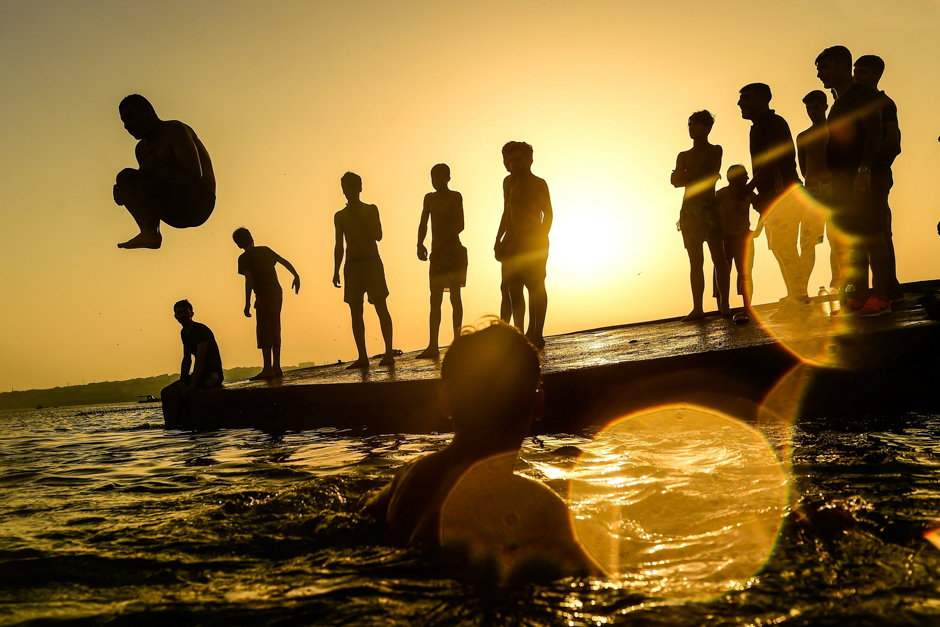 A man dives in the sea on the beach at Menekse, in Istanbul. PHOTO: AFP