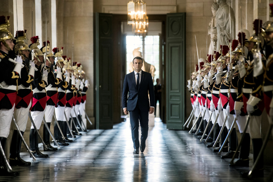 French President Emmanuel Macron walks through the Galerie des Bustes (Busts Gallery) to access the Versailles Palace's hemicycle near Paris, France. PHOTO: REUTERS