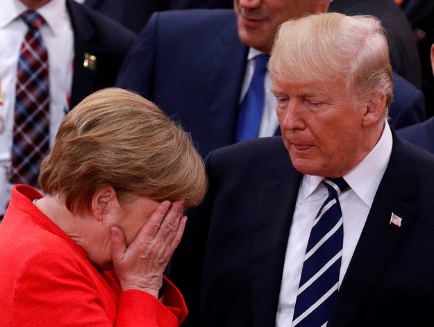 German Chancellor Angela Merkel reacts next to U.S. President Donald Trump during the G20 leaders summit in Hamburg, Germany. PHOTO: REUTERS