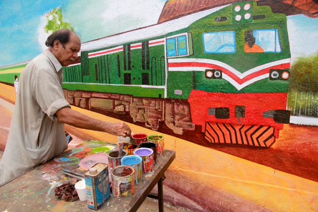 Artist Fateh Muhammad feels lucky that he has been a part of the project. PHOTO: ATHAR KHAN