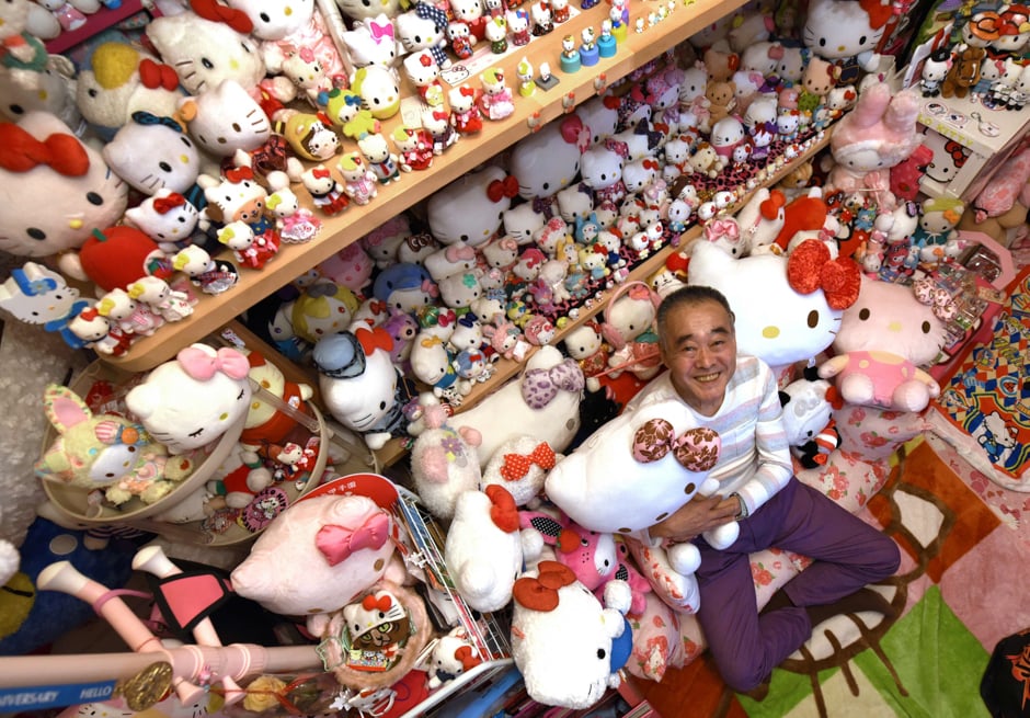 Retired Japanese police officer Masao Gunji posing with his Hello Kitty collection at his pink-painted Hello Kitty house in Yotsukaido. PHOTO: AFP