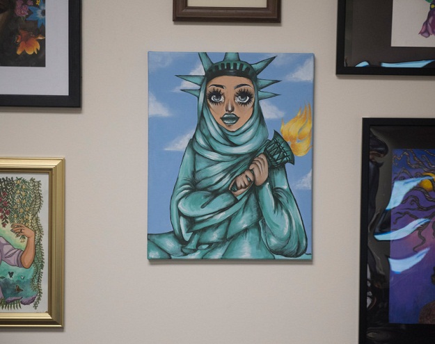 A student painting of the Statue of Liberty in a Muslim hijab, hanging in Congressman Lou Correa's Santa Ana office, is being attacked as an unpatriotic violation of the separation of church and state by members of We the People Rising, a Claremont-based activist group that advocates stricter enforcement of illegal immigration laws in Santa Ana on Thursday, August 3, 2017. (Photo by Sam Gangwer, Orange County Register/SCNG)