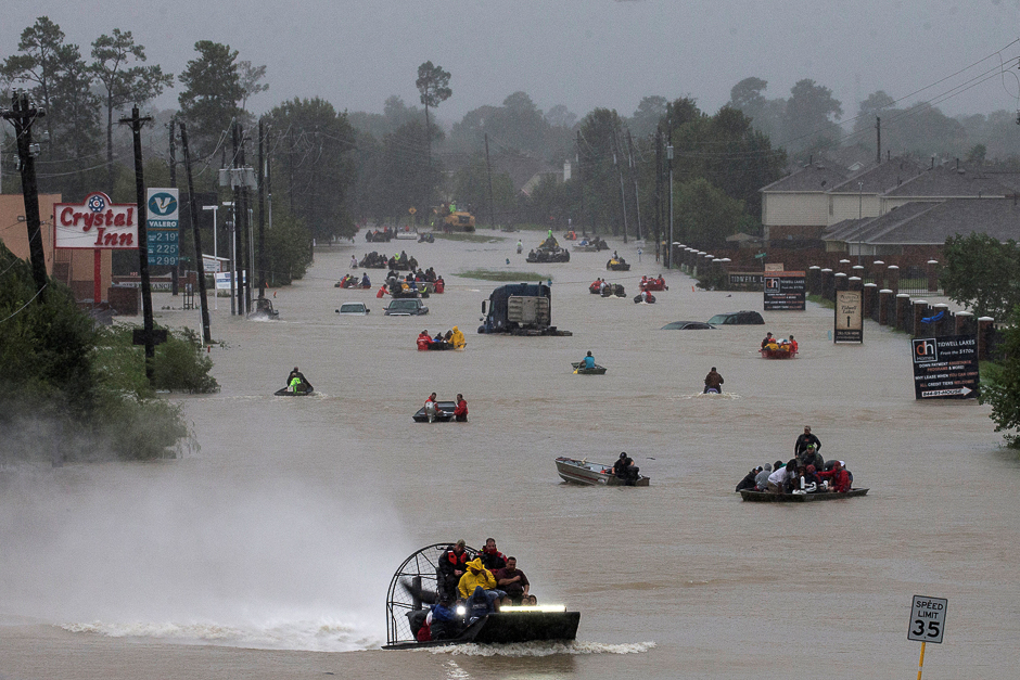 Residents use boats to evacuate flood waters from Tropical Storm Harvey along Tidwell Road east Houston, Texas, US. PHOTO: REUTERS