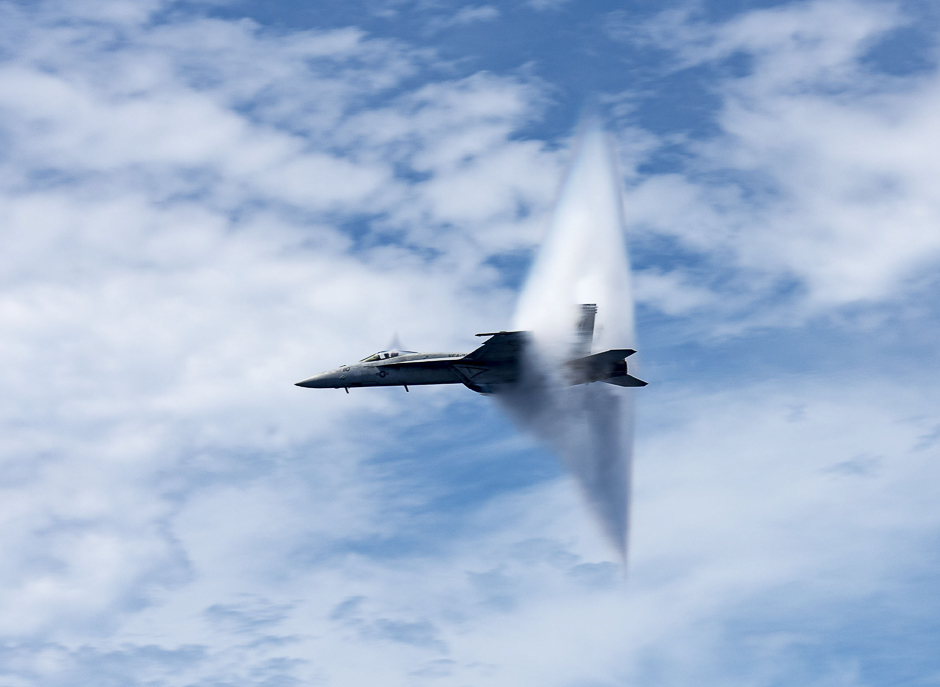 F/A-18E Super Hornet breaks the sound barrier during an air power demonstration over the Atlantic Ocean. PHOTO: AFP