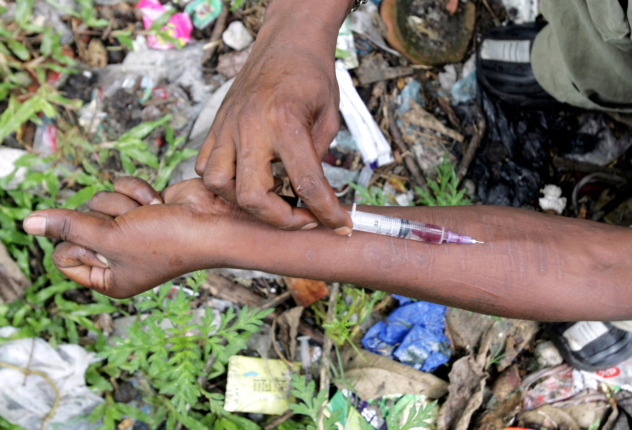 an injecting drug user injects himself with fortwin on a roadside photo reuters