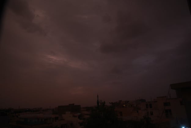 a view of the greyish overcast sky in the city wednesday evening before the light drizzle and rain photo athar khan