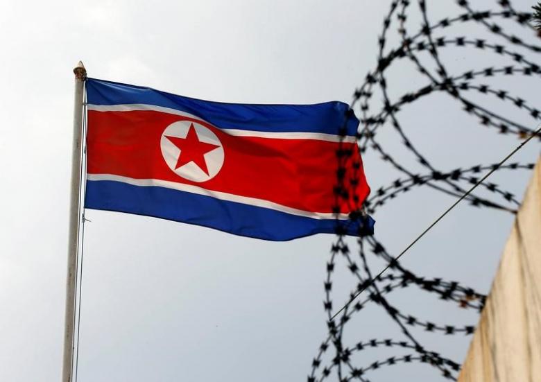 the north korea flag flutters next to concertina wire at the north korean embassy in kuala lumpur malaysia photo reuters