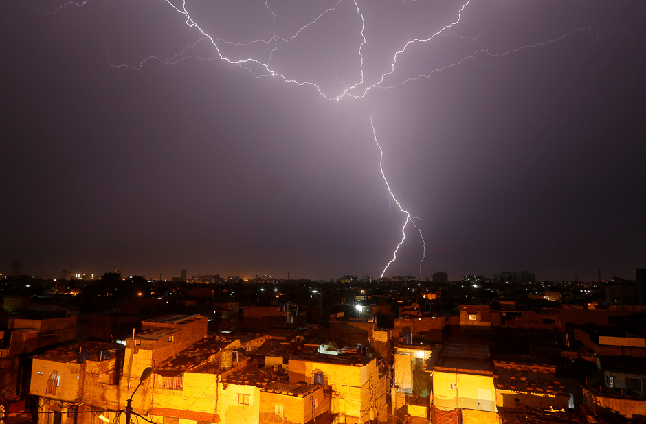 Lightning bolt is seen above a residential neighbourhood during rain in Karachi, Pakistan. PHOTO: REUTERS