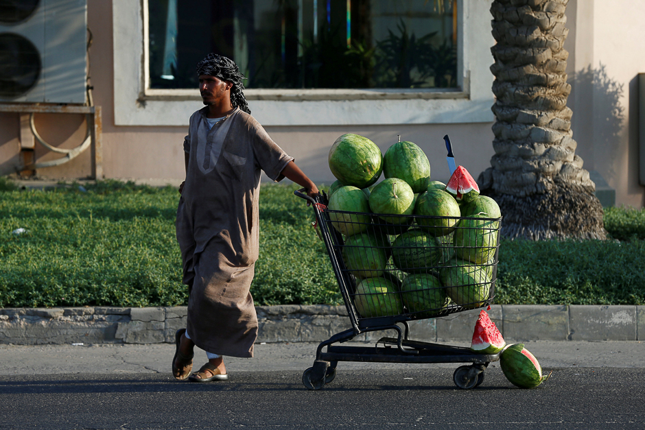 A vendor sells watermelons in Dammam, Saudi Arabia. PHOTO: REUTERS