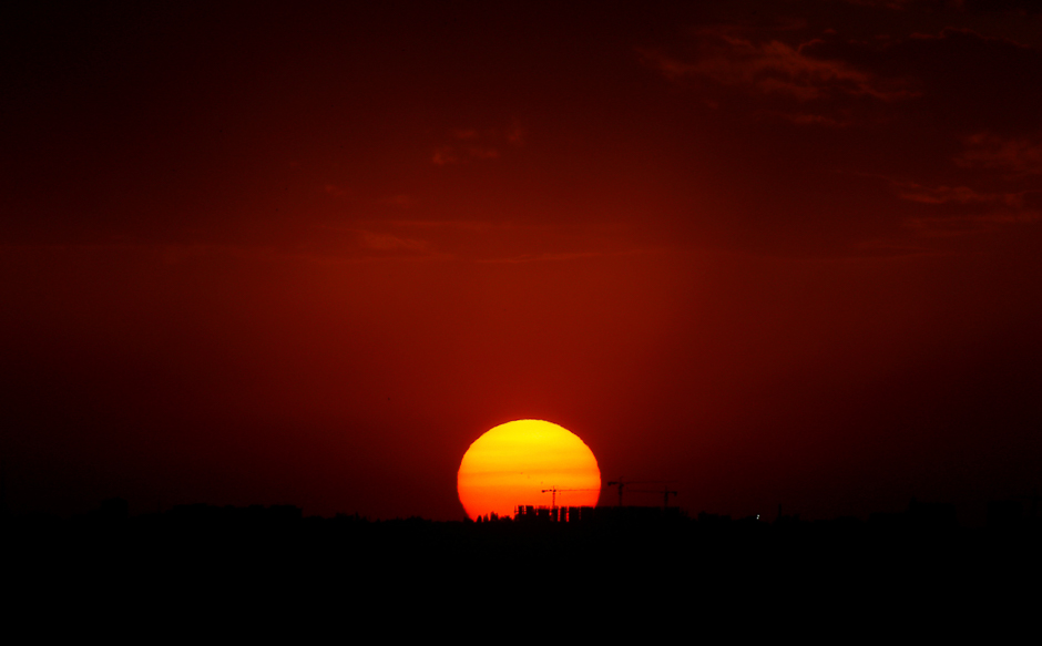 The sun sets over construction site in Rostov-On-Don, Russia. PHOTO: REUTERS