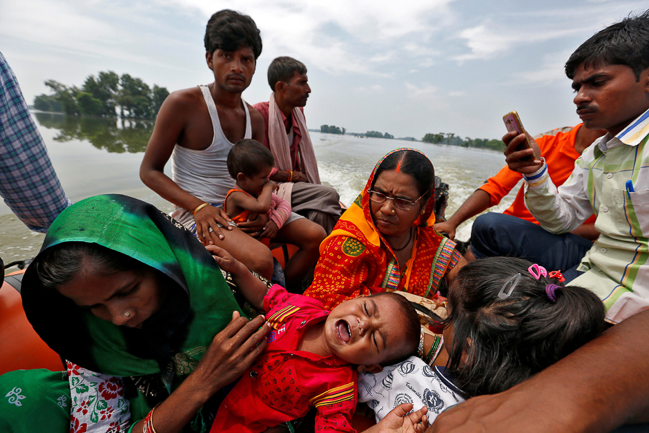 A baby suffering from dehydration cries after being rescued from a flooded village in the eastern state of Bihar, India. PHOTO: REUTERS