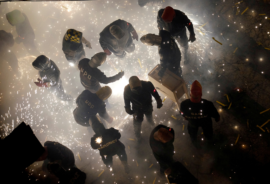 Revellers play with fireworks during the annual 