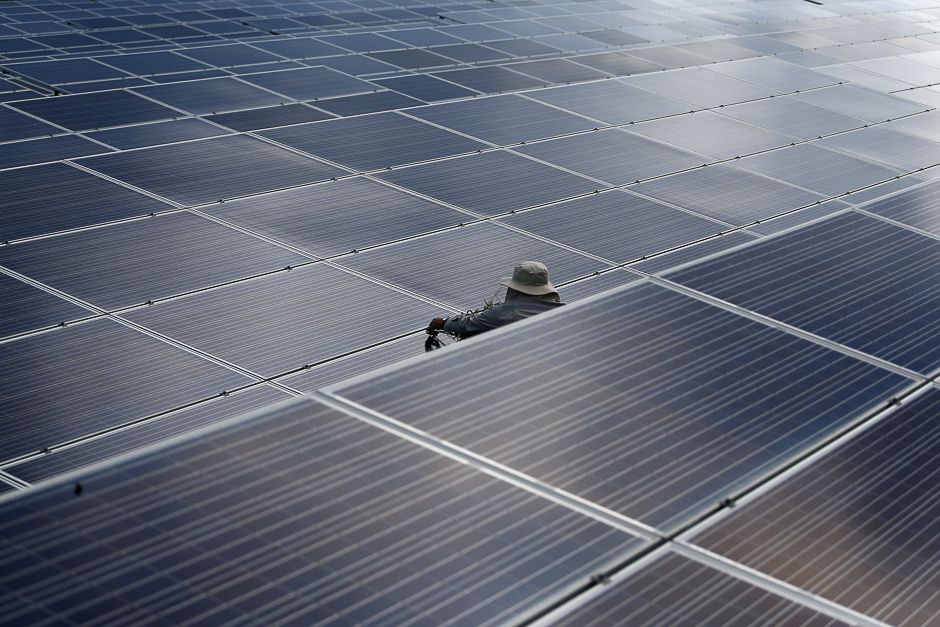 A worker works at a solar power plant by Superblock, Southeast Asia's biggest producer of solar power in Phetchaburi province, Thailand. PHOTO: REUTERS
