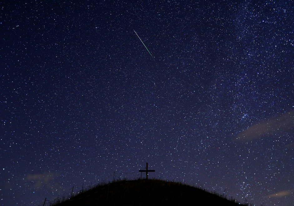 A meteor streaks past stars in the night sky above Leeberg hill during the Perseid meteor shower in Grossmugl, Austria. PHOTO: REUTERS