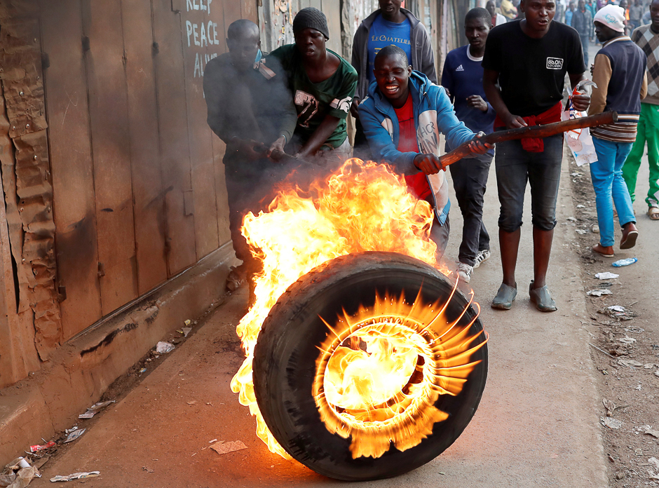 Supporters of opposition leader Raila Odinga set up flaming tyre barricade in Kibera slum in Nairobi, Kenya. PHOTO: REUTERS