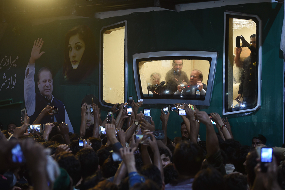 Ousted Pakistani prime minister Nawaz Sharif addresses a rally from his bullet-proof container in Rawalpindi. PHOTO: AFP