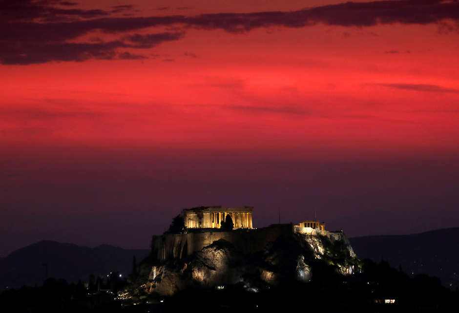 A summer storm is seen approaching at sunset over the Temple of Parthenon atop the ancient Acropolis hill in central Athens. PHOTO: REUTERS