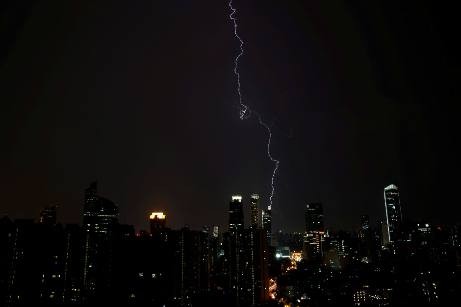 Lightning is seen above buildings during a storm in central Shanghai, China. PHOTO: REUTERS