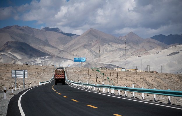 A truck drives along the China-Pakistan Friendship Highway before the Karakorum mountain range near Tashkurgan in China's western Xinjiang province. PHOTO: AFP