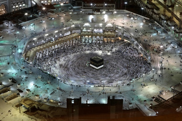 This long exposure photograph shows Muslim pilgrims circumambulating the Kaaba, Islam's holiest shrine, at the Grand Mosque in Saudi Arabia's holy city of Makkah. PHOTO: AFP