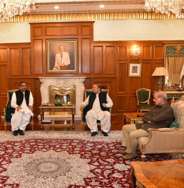PM Abbasi with the Sharif brothers. PHOTO: EXPRESS