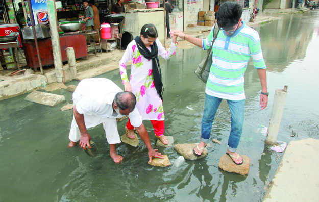 Much to everyone's disappointment the 33mm rainfall also caused chaos in the city. PHOTO: ATHAR KHAN/EXPRESS