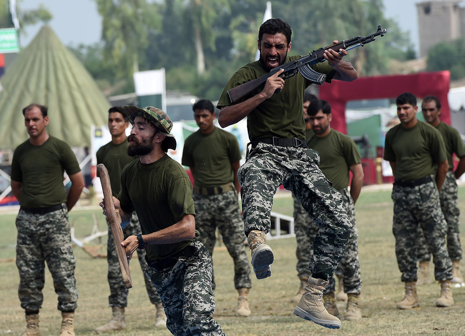 Soldiers perform during a ceremony to mark the country's Defence Day in Peshawar, Pakistan. PHOTO: AFP