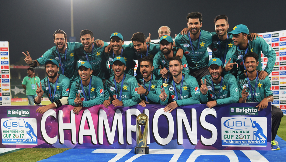 Pakistani cricketers pose for a photograph with trophy after winning the third and final Twenty20 International match against World XI. PHOTO: AFP